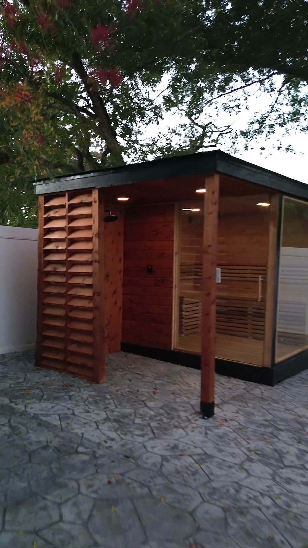 Outdoor sauna glowing at twilight
