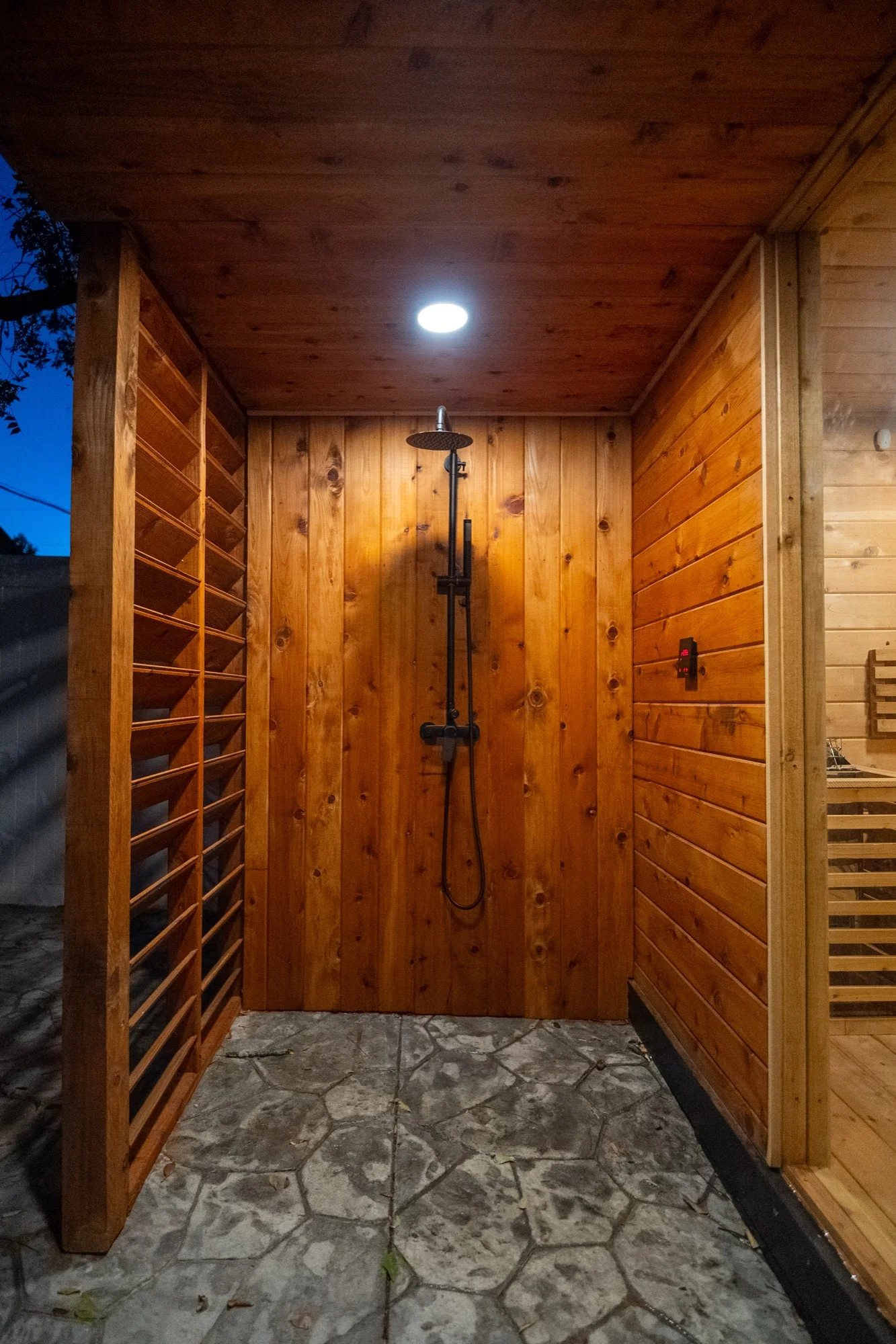 Outdoor cedar shower with rainfall showerhead